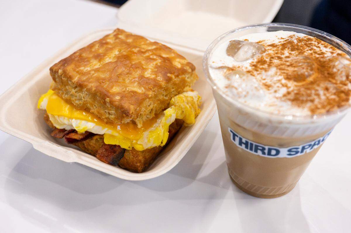 Homemade biscuits are core to the menu at Third Space, available alone or as the vehicle for a bacon, egg and cheese sandwich, pictured here with a horchata iced coffee.