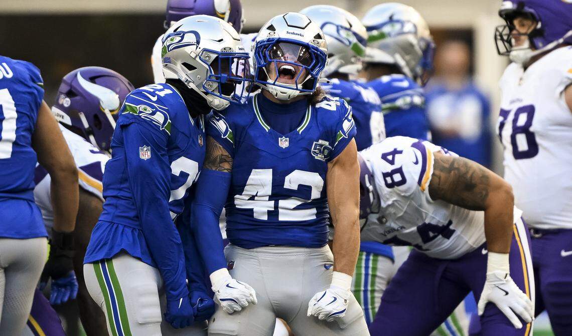 Seattle Seahawks linebacker Drake Thomas (42) reacts to stuffing the run from Minnesota Vikings running back Aaron Jones Sr. (33) during the third quarter of the game at Lumen Field, on Sunday, Nov. 30, 2025, in Seattle.