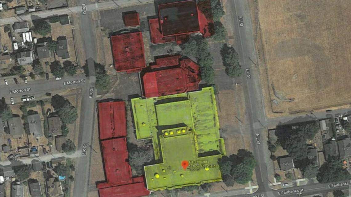 A map shows an aerial view of Gault Middle School in Tacoma. The areas outlined in red indicate buildings slated for demolition, while the yellow area shows the original 1926 building that will not be demolished.