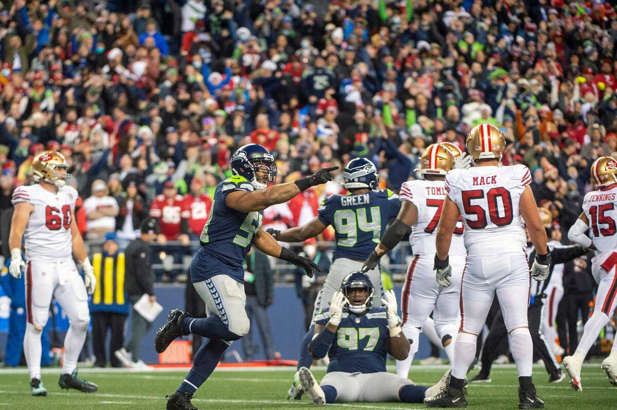 Seahawks middle linebacker Bobby Wagner (54) points to the sideline after the Seattle defense held off the San Francisco 49ers’ late-game drive in the fourth quarter of an NFL game on Sunday at Lumen Field in Seattle.