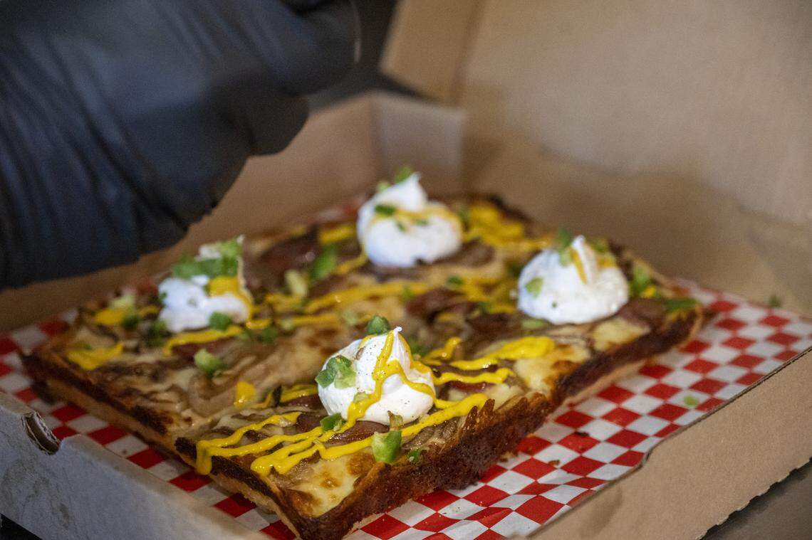 The Seattle Dog is just one of many fun specials at Tacoma Pie on Sixth Ave, which specializes in a hybrid rectangular pizza inspired by Detroit, Sicilian and Grandma styles.