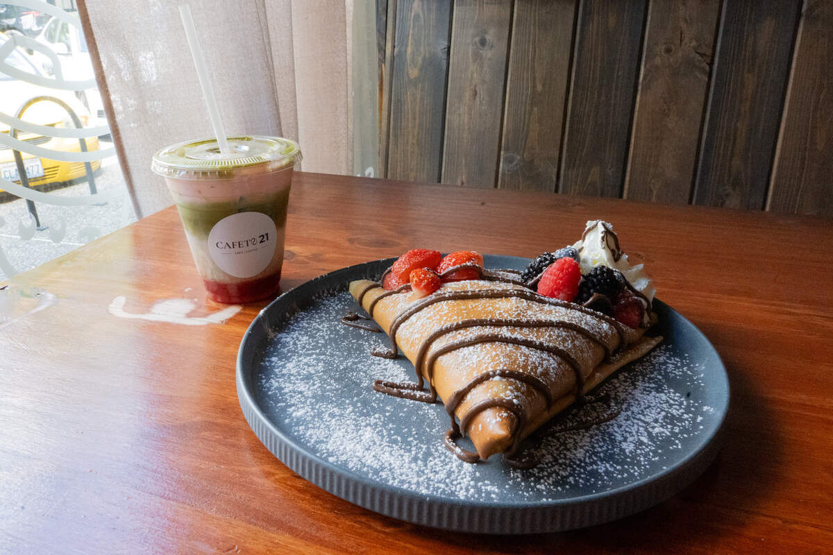 A strawberry matcha and a Berries Delight crepe from Cafeto 21 in Tacoma. The Berries Delight crepe comes with strawberries, blueberries, blackberries, raspberries and Nutella, topped with whipped cream and powdered sugar.