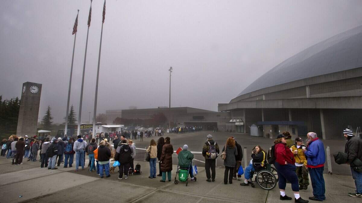A long line of people stood in the cold during Project Homeless Connect at the Tacoma Dome Exhibition Hall on October 23, 2013. Associated Ministries recently decided to take a more active role in advocating for governmental policy aimed at helping the city’s most vulnerable residents.