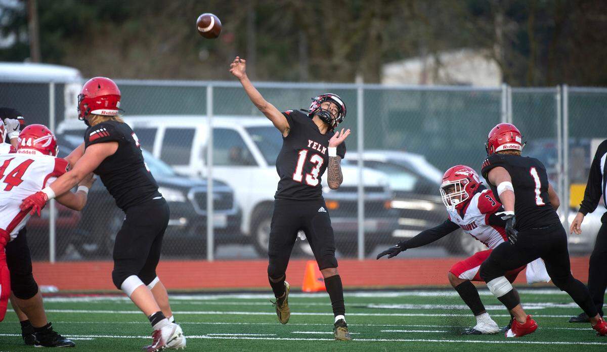 Yelm quarterback Palaina Hooper lets fly a deep pass during Saturday afternoon’s 3A football state quarterfinal game against the Marysville-Pilchuck Tomahawks at Yelm High School in Yelm, Washington, on Nov. 20, 2021. Marysville-Pilchuck won the game, 39-21.