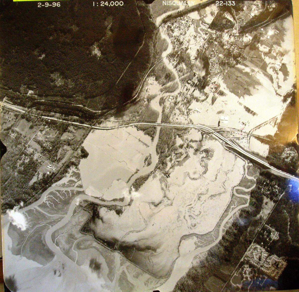 An aerial shot of the 1996 flood depicts the risk of flooding the Nisqually River during high rainfall. Much of the Nisqually Valley was submerged underwater for days.