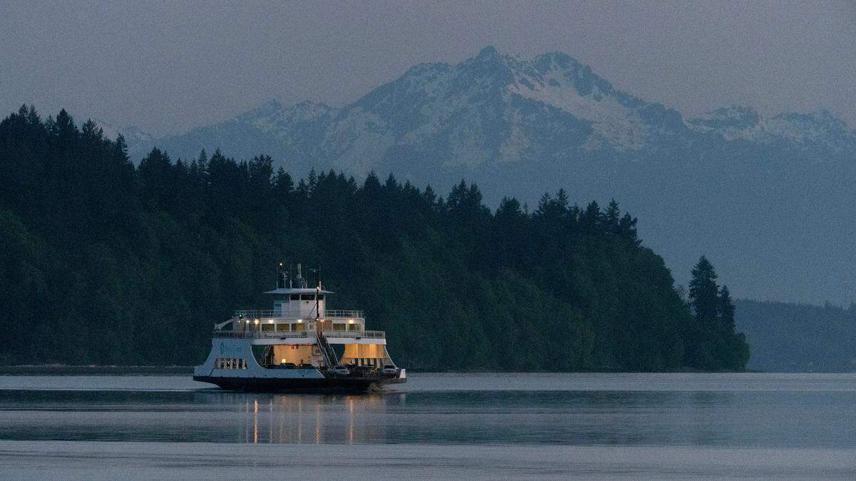 The 5:15 am M/V Christine Anderson ferry from Anderson Island, Washington, cruises into Steilacoom at dawn on Tuesday, May 9, 2023.