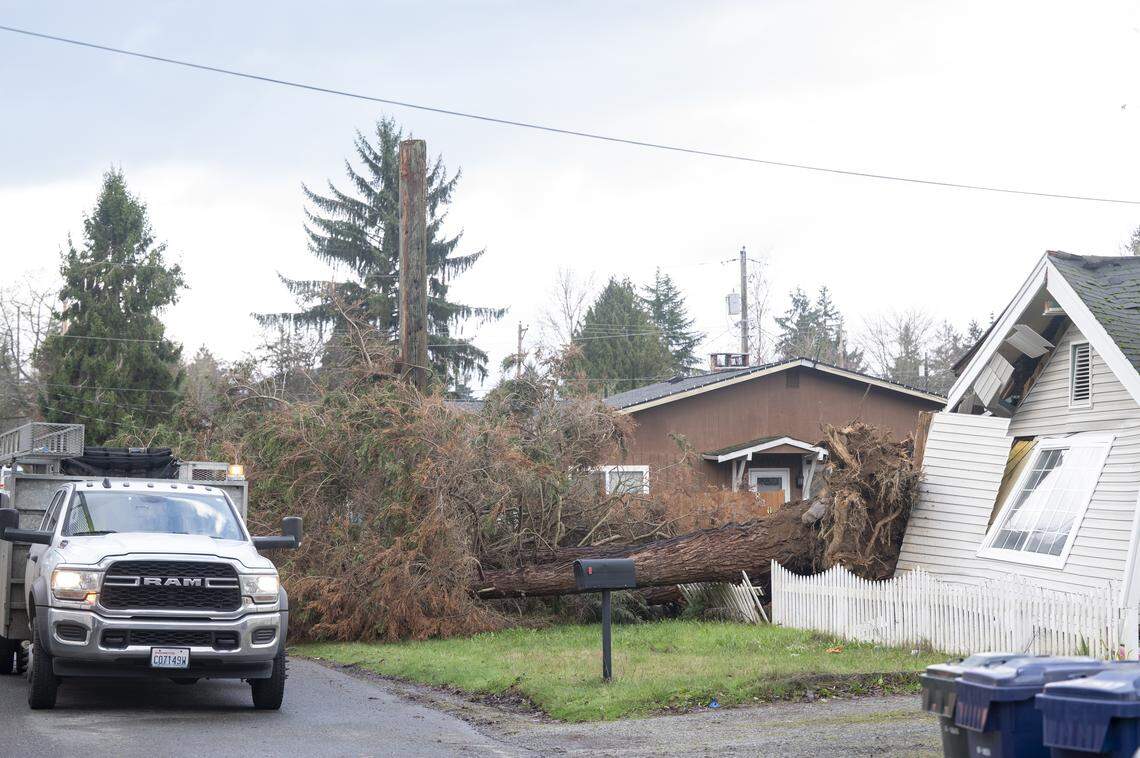 A portion of East 82nd Street is closed after a tree crashed into a home in Tacoma in December 2025.
