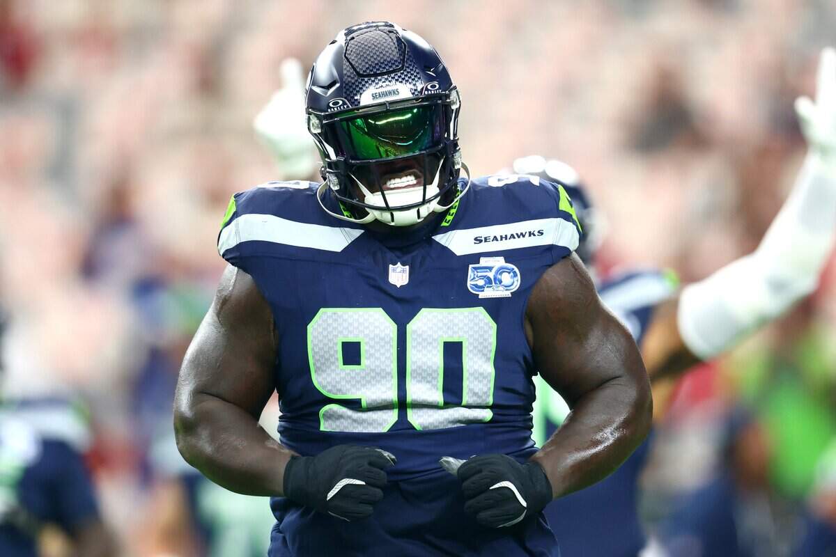 Seattle Seahawks defensive tackle Jarran Reed (90) reacts before the game against the Arizona Cardinals at State Farm Stadium. Mandatory Credit: Mark J. Rebilas-Imagn Images