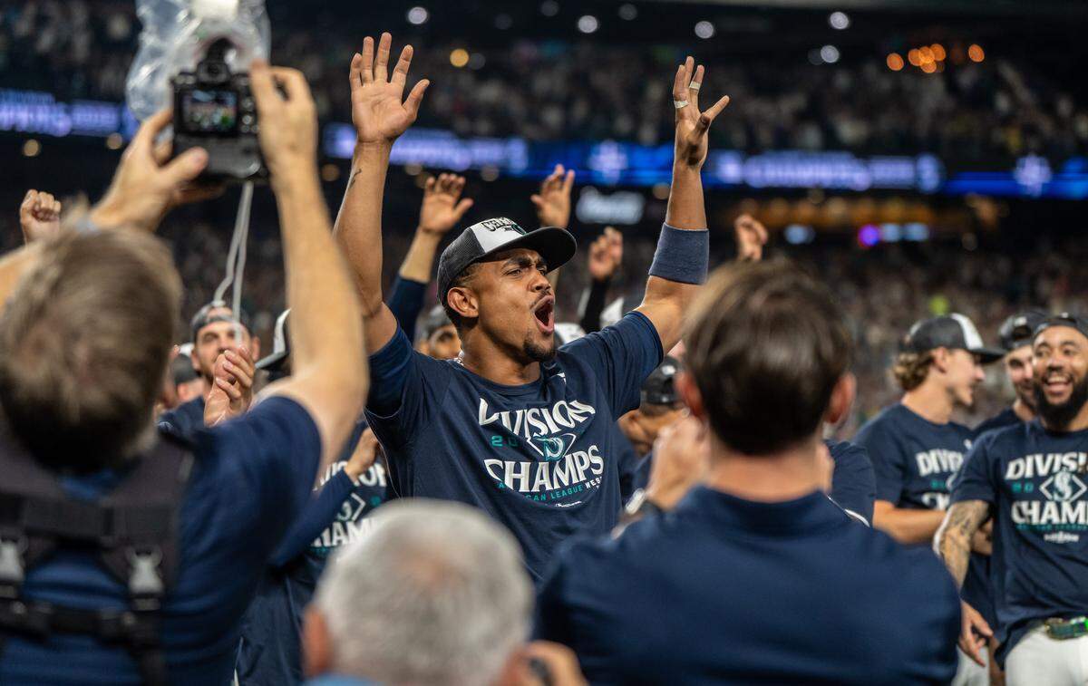 Sep 24, 2025; Seattle, Washington, USA; Seattle Mariners centerfielder Julio Rodriguez (44) celebrates after winning the American League Division in a game against the Colorado Rockies at T-Mobile Park. Mandatory Credit: Stephen Brashear-Imagn Images