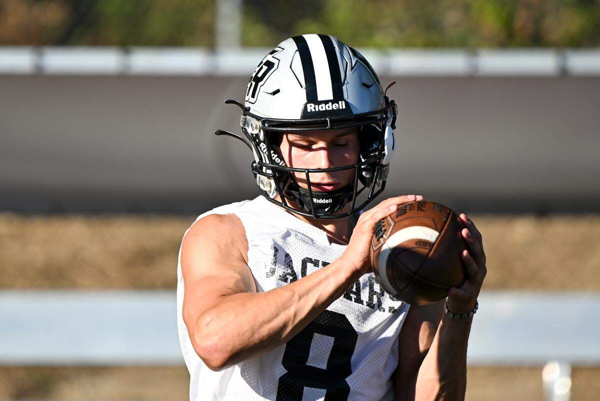 Emerald Ridge wide receiver Gio Kafentzis does a catching drill during a football practice at Emerald Ridge High School, Wednesday, Aug. 16, 2023, in Puyallup, Wash.