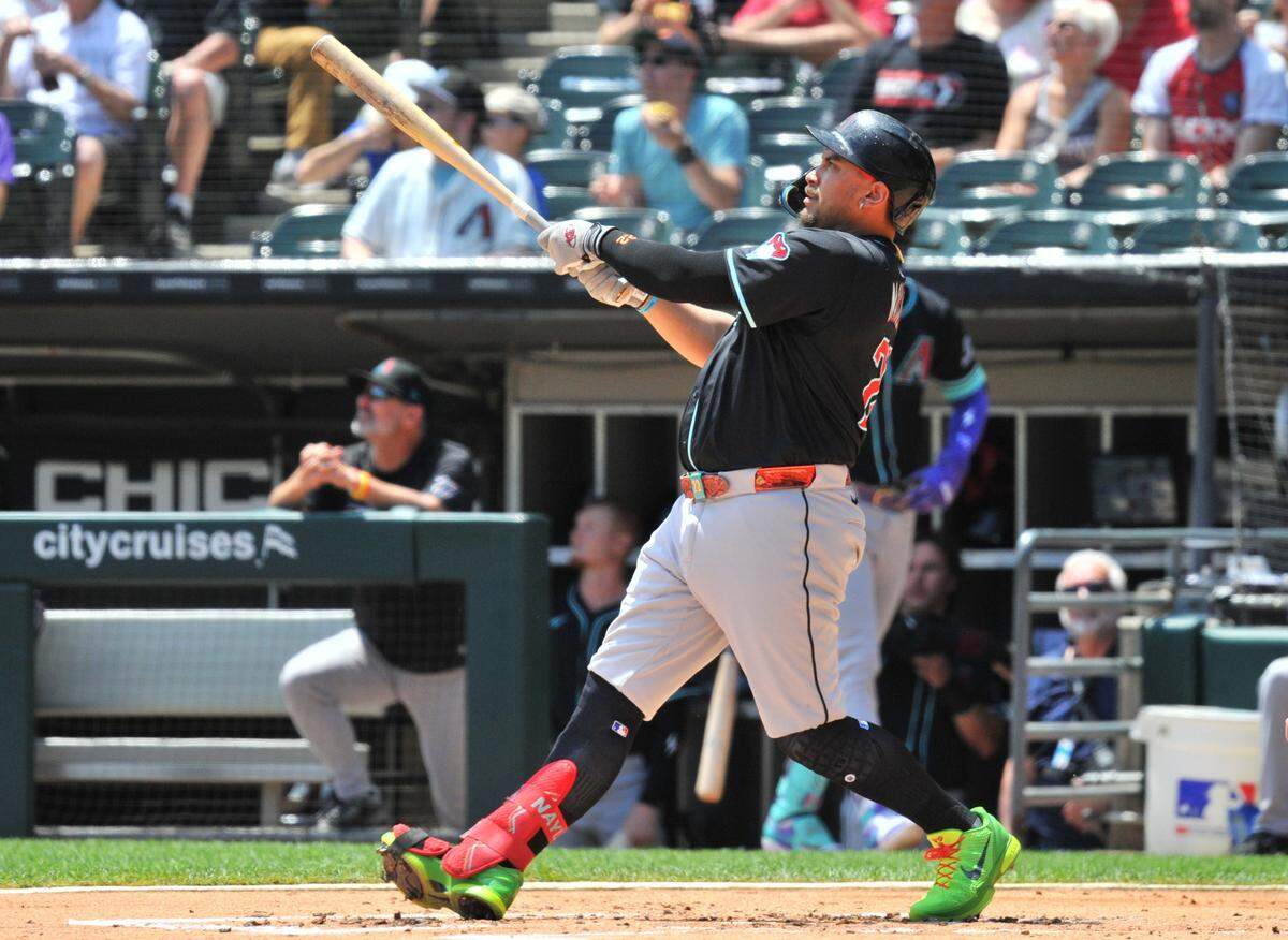Jun 25, 2025; Chicago, Illinois, USA; Arizona Diamondbacks first baseman Josh Naylor (22) watches his two-run home run during the first inning against the Chicago White Sox at Rate Field. Mandatory Credit: Patrick Gorski-Imagn Images