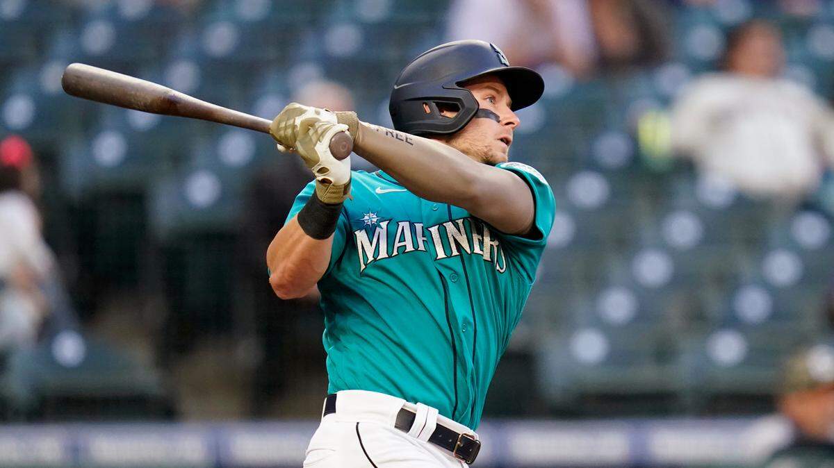 Seattle Mariners’ Jarred Kelenic watches his two-run home run against the Cleveland Indians in the third inning of a baseball game Friday, May 14, 2021, in Seattle. (AP Photo/Elaine Thompson)