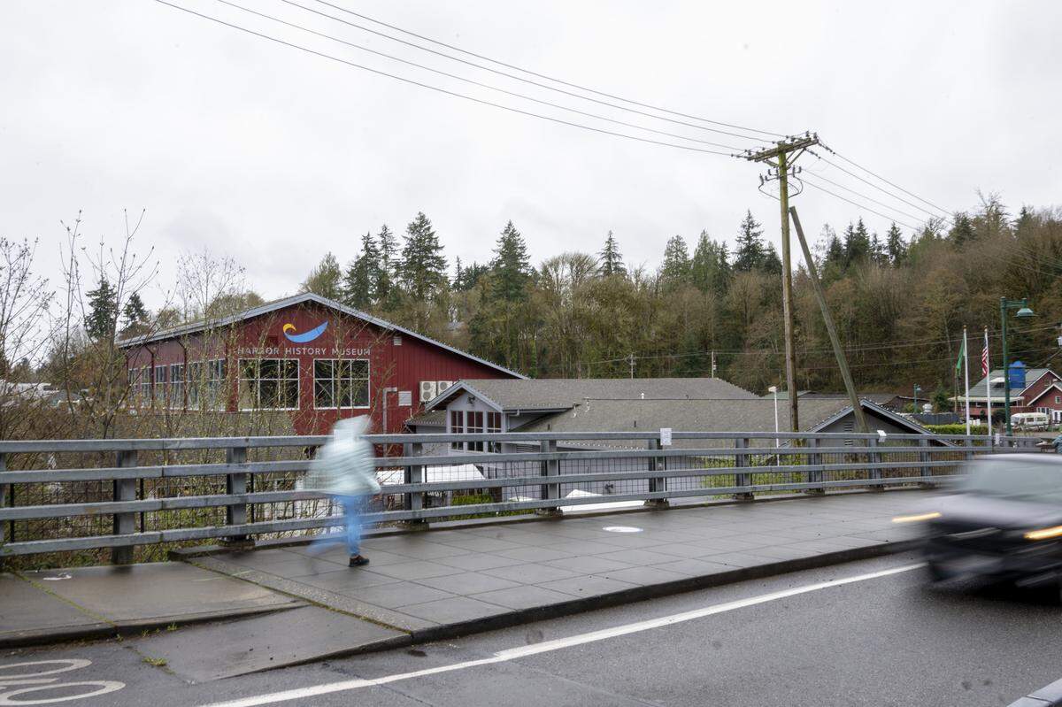 Pedestrians and cars move along a bridge over Donkey Creek on Wednesday, March 25, 2026, in Gig Harbor. Hundreds of locks were removed from the bridge.