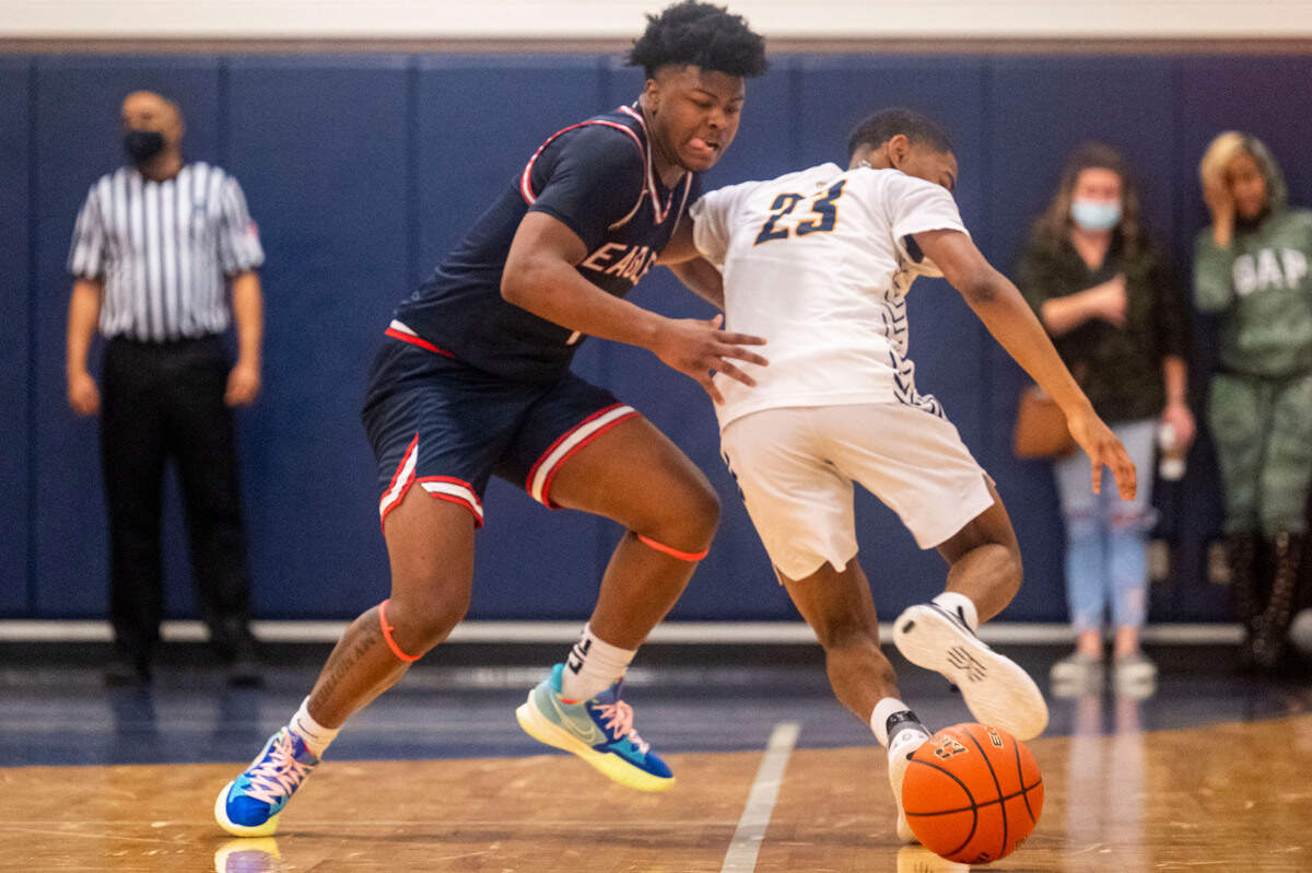 Life Christian guard Daishaun Nichols (1) steals the ball away from Annie Wright guard TJ Marshall (23) during the fourth quarter of a 1A Nisqually League game on Thursday, Feb. 10, 2022, at Annie Wright School in Tacoma, Wash.