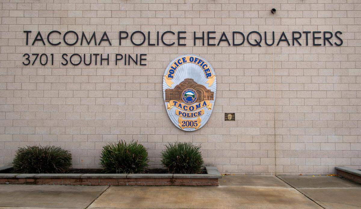 A large representation of an officer’s badge is displayed outside the front entrance of the Tacoma Police Department headquarters at 3701 S. Pine St. on Nov. 26, 2020.
