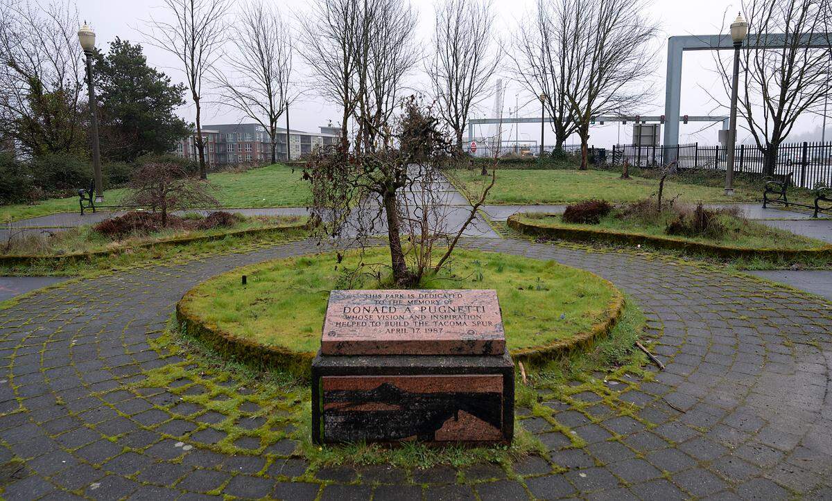 Donald A. Pugnetti Park at the intersection of I-705 and Pacific Avenue was dedicated in 1987 to honor the longtime Tacoma News Tribune editor. The park is owned and maintained by the Washington Department of Transportation, but appears that poor maintenance has left the park in disrepair and an eyesore.