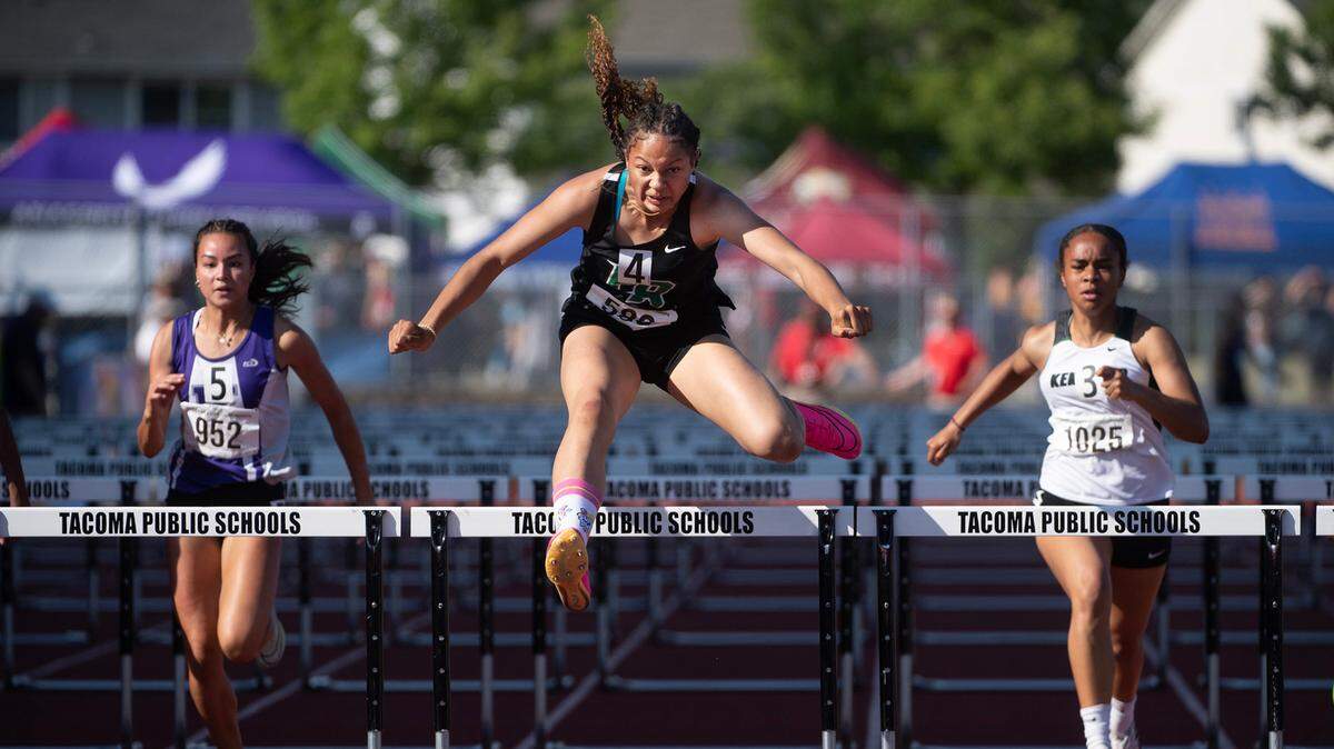 Emerald Ridge’s JaiCieonna Gero-Holt runs to a state title in the 4A girls 100-meter hurdles during the second day of the WIAA state track and field championships at Mount Tahoma High School in Tacoma, Washington, on Friday, May 26, 2023. Just minutes earlier, Gero-Holt won the high jump state title, giving her three state championships in two days.