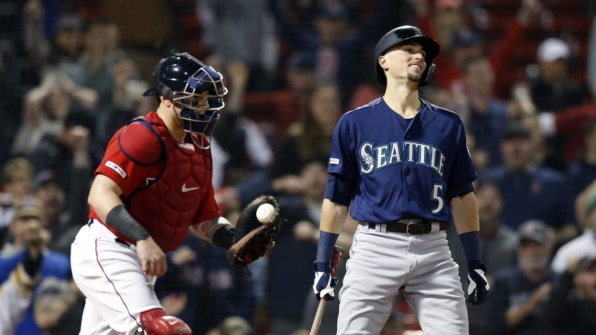 Seattle Mariners’ Braden Bishop (5) reacts beside Boston Red Sox’s Christian Vazquez after being called out on strikes to end the baseball game in Boston, Friday, May 10, 2019. Boston won 14-1. (AP Photo/Michael Dwyer)
