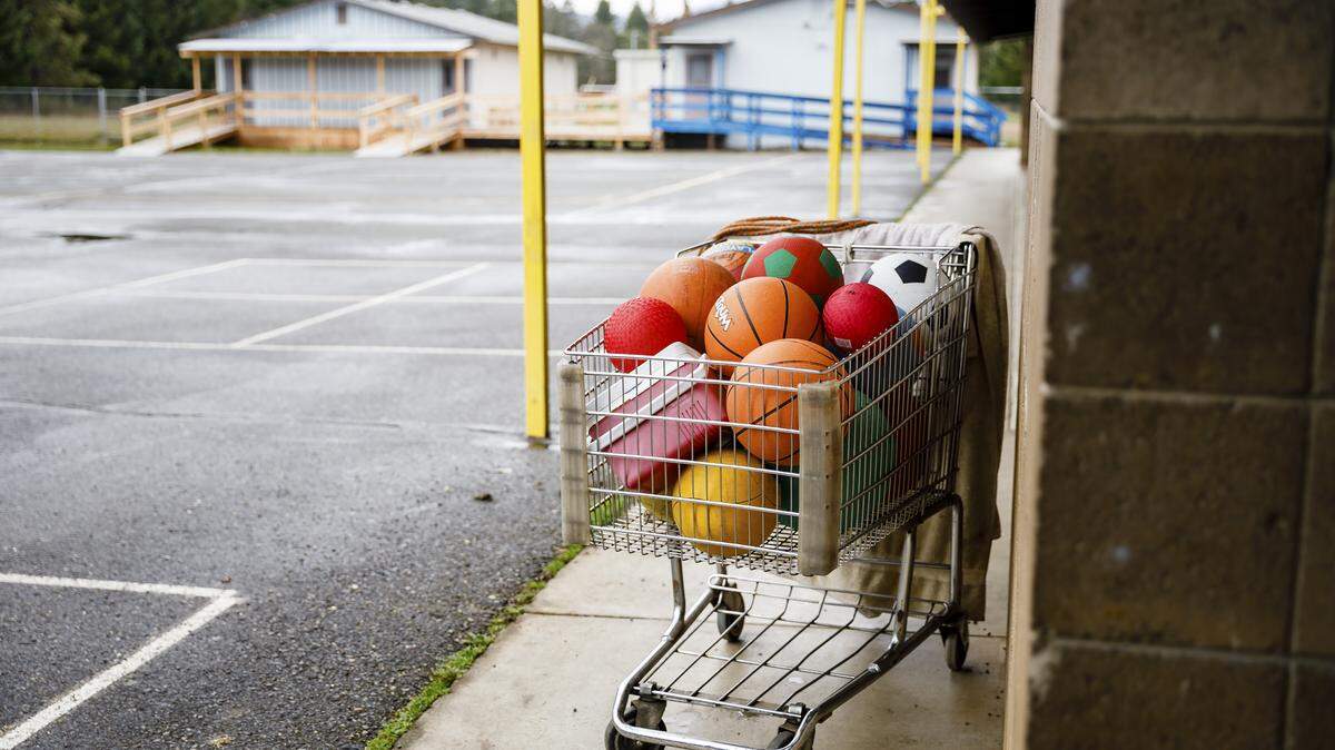 A shopping cart full of balls at Evergreen Elementary School in Cave Junction, Ore., which operates without a physical education teacher, March 22, 2018. Oregon is facing a severe, self-inflicted crisis as mounting pension obligations crowd out the rest of its budgets.