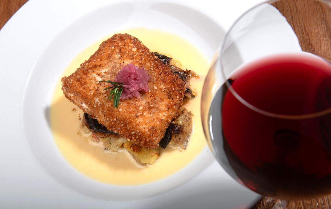 Paired with pinot noir, the pan-seared and pecan-panko crusted halibut is joined for the winter season by smashed sweet potato and Swiss chard in a rosemary-bourbon cream sauce.