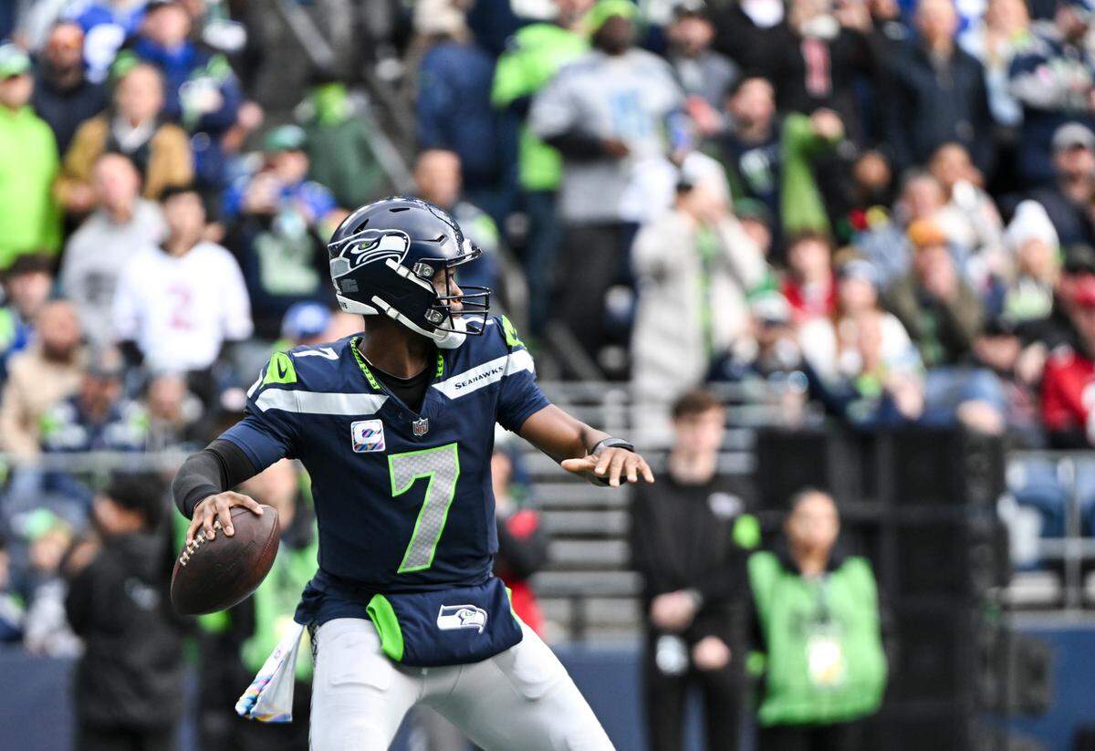 Seattle Seahawks quarterback Geno Smith (7) drops back to pass during the second quarter of the game against the Arizona Cardinals at Lumen Field, Sunday, Oct. 22, 2023, in Seattle, Wash.
