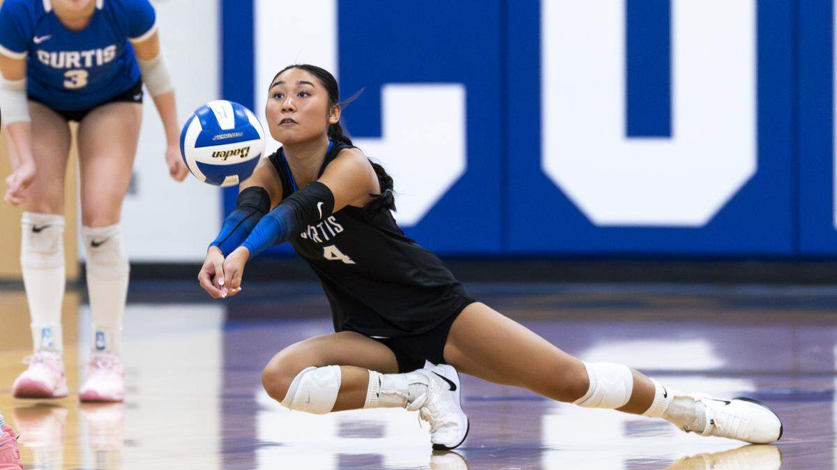 Curtis libero Elaina Duong (4) digs the ball against the Kennedy Catholic Lancers during the volleyball match at Curtis Senior High School, on Thursday, Sept. 18, 2025, in University Place, Wash.