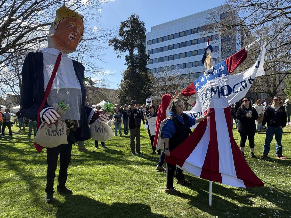 Many people attending the “No Kings" rally came costumed, including a protestor in a large papier-mâché Trump puppet on Saturday, March 28, 2026.