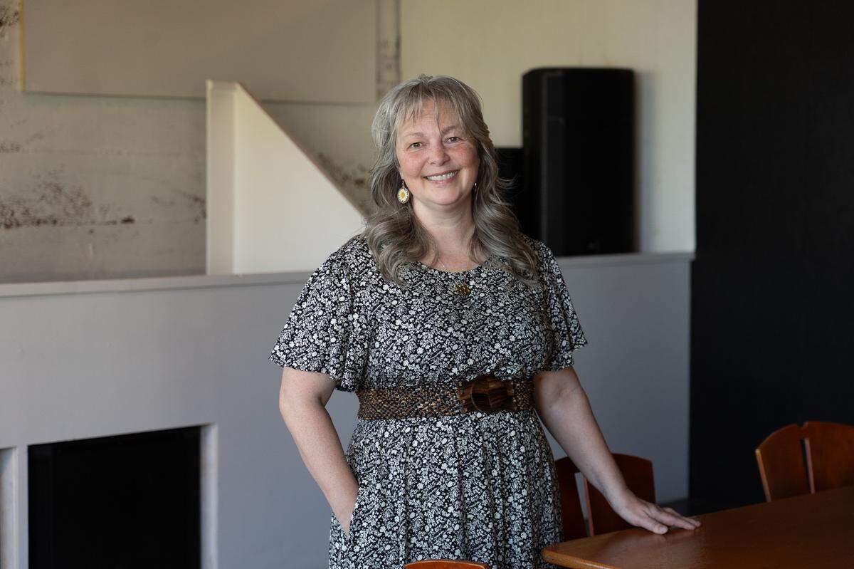 Leah Browning, owner of The Poet, smiles for a portrait inside the venue on May 11, 2026.