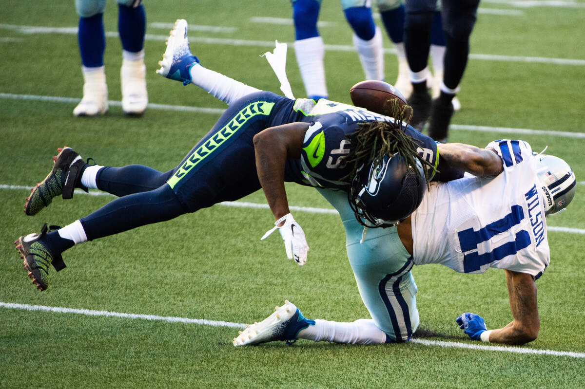 Seattle’s Shaquem Griffin breaks up a pass intended for Cedrick Wilson during the fourth quarter. The Seattle Seahawks played the Dallas Cowboys in a NFL football game at CenturyLink Field in Seattle, Wash., on Sunday, Sept. 27, 2020.