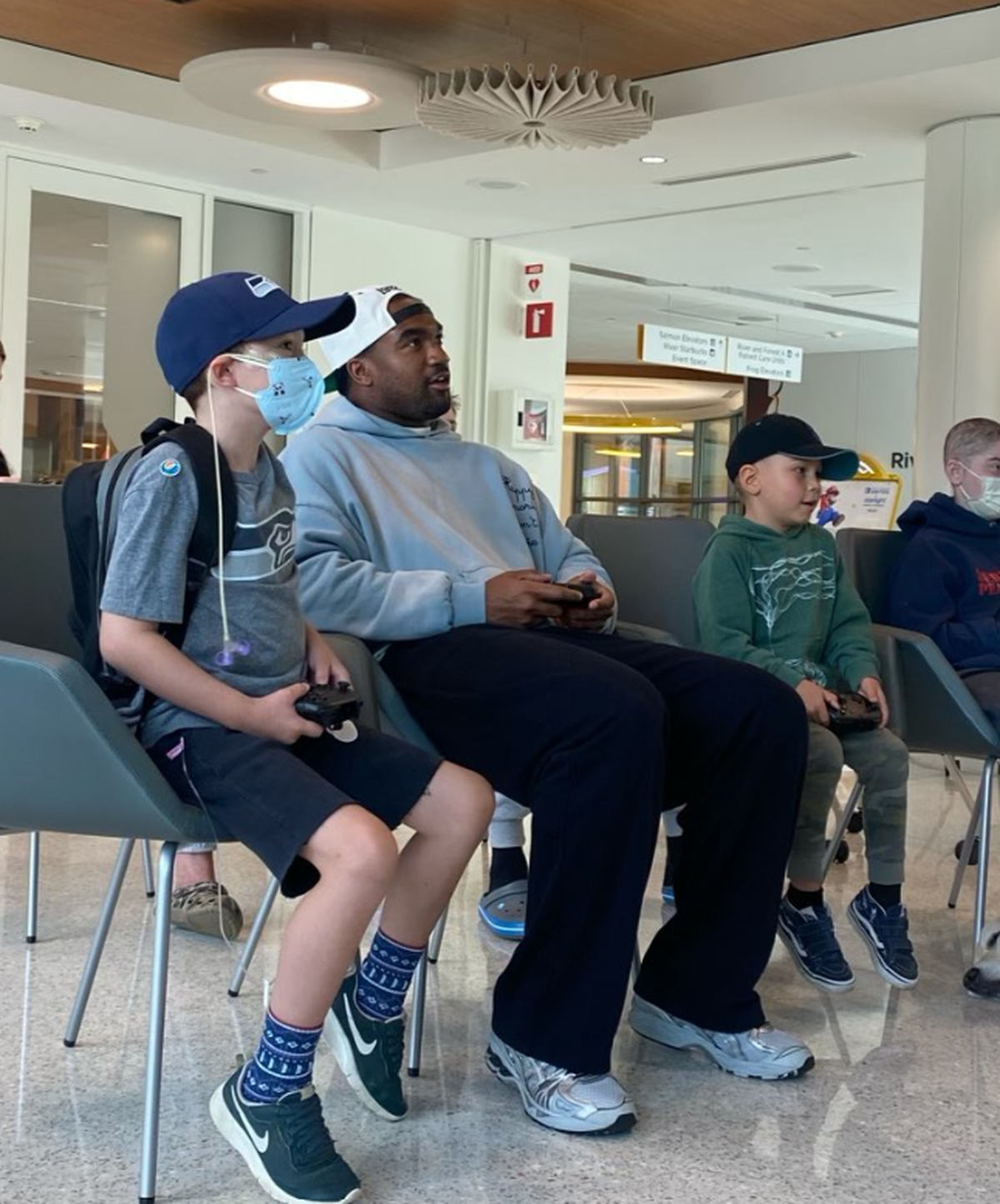 Seahawks linebacker Tyrel Dodson playing the Mario Kart video game with patients at Seattle Children’s hospital in its Therapeutic Gaming unit Monday, Sept. 17, 2024.