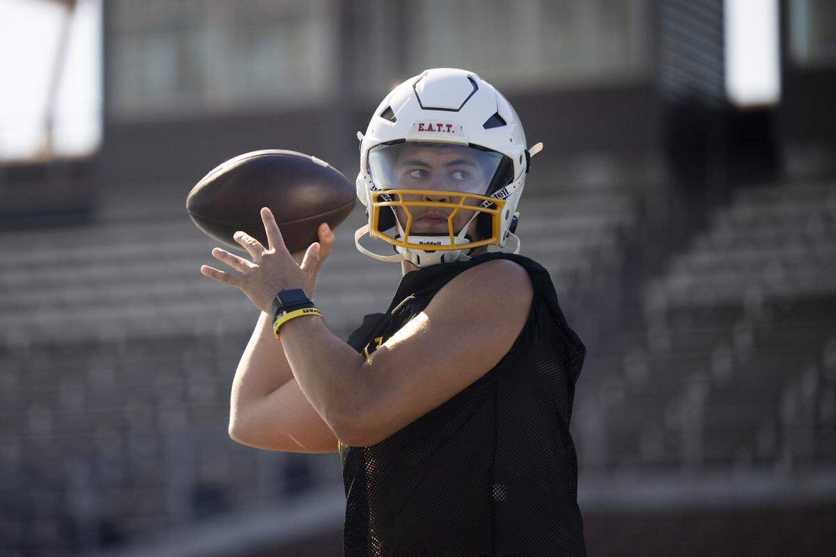 Mount Tahoma quarterback Mikkah Cordero throws during a football practice at Mount Tahoma High School on Wednesday, Aug. 20, 2025, in Tacoma, Wash..