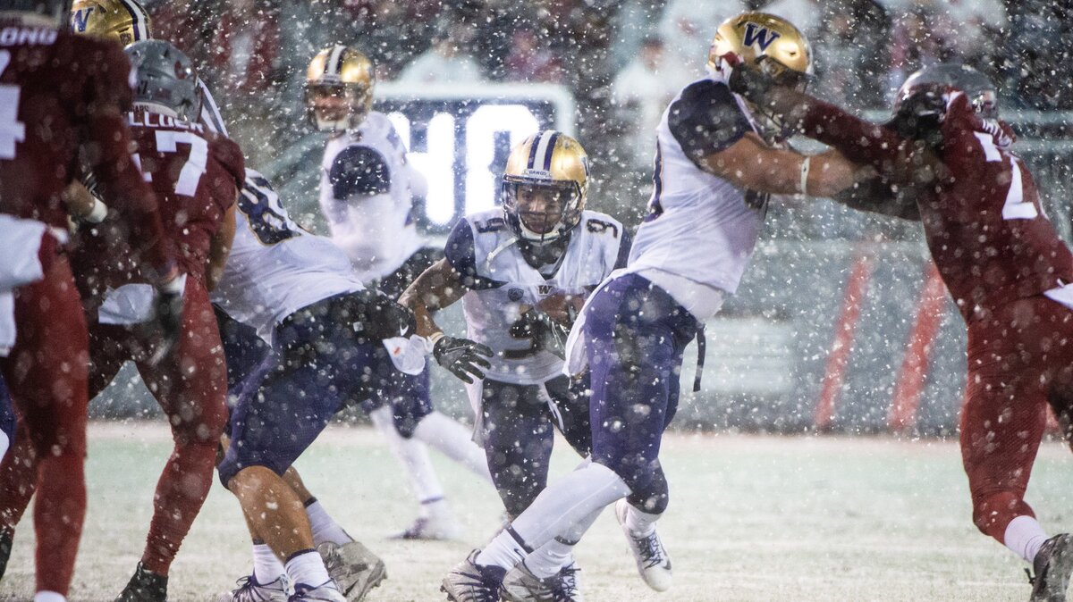 Washington running back Myles Gaskin rushes in the second quarter. The Washington Huskies played the Washington State Cougars in the Apple Cup at Martin Stadium in Pullman, Wash., on Friday, Nov. 23, 2018.