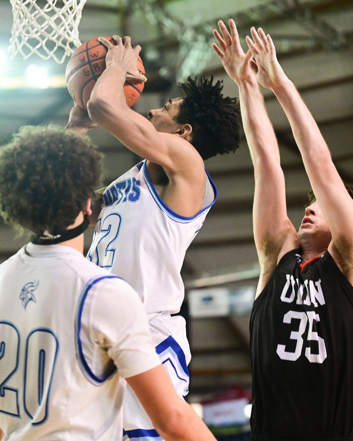 Curtis guard Devin Whitten (32) attempts a shot as forward Josiah Baldassare (44) defends during the fourth quarter of a Class 4A state tournament semifinal game on Friday, March 4, 2022, at the Tacoma Dome, in Tacoma, Wash.