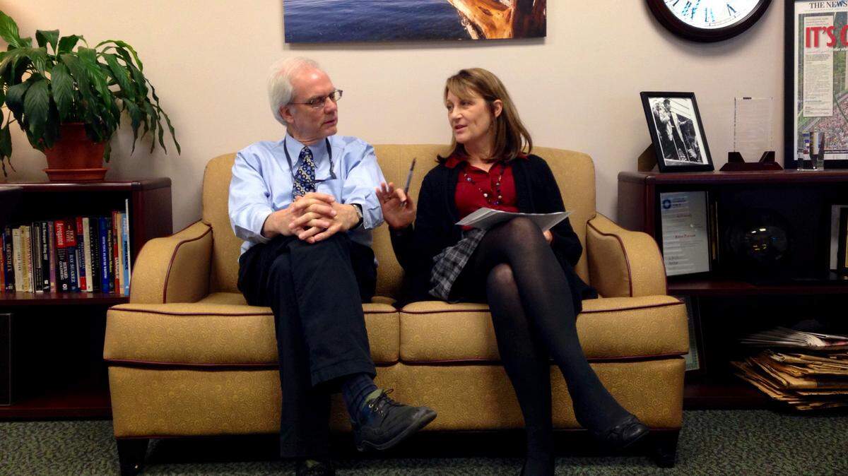 Randy McCarthy and Karen Peterson discuss a story about a same-sex wedding at the Special Commitment Center on McNeil Island during a meeting in Peterson’s office, Oct. 28, 2013.