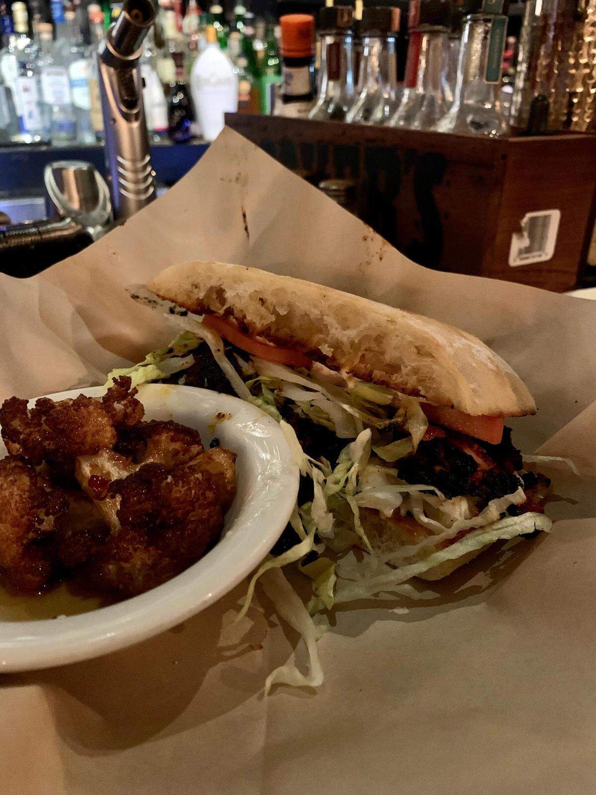 The Southern-inspired menu at 1022 South J in the Hilltop neighborhood of Tacoma, Wash., provides creative choices to sop up the bar’s well-crafted cocktails. You can choose fried or grilled shrimp, as picture here, in the po’boy, with an array of seasonal sides, like this blackened cauliflower.