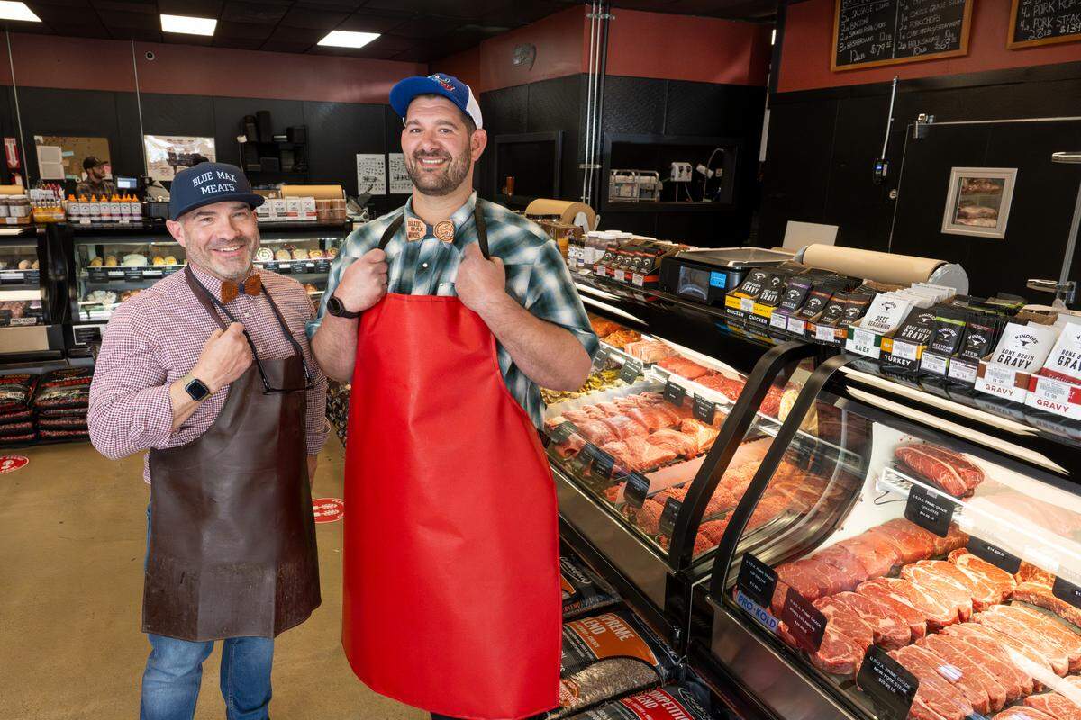 Tommy Marshall, left, and Evan Greco bought Blue Max Meats in 2013 and opened a Buckley store in 2016. They have 45 employees and are always eager to train anyone with a positive attitude, they said, as maybe half of their staff started with meat-cutting experience.