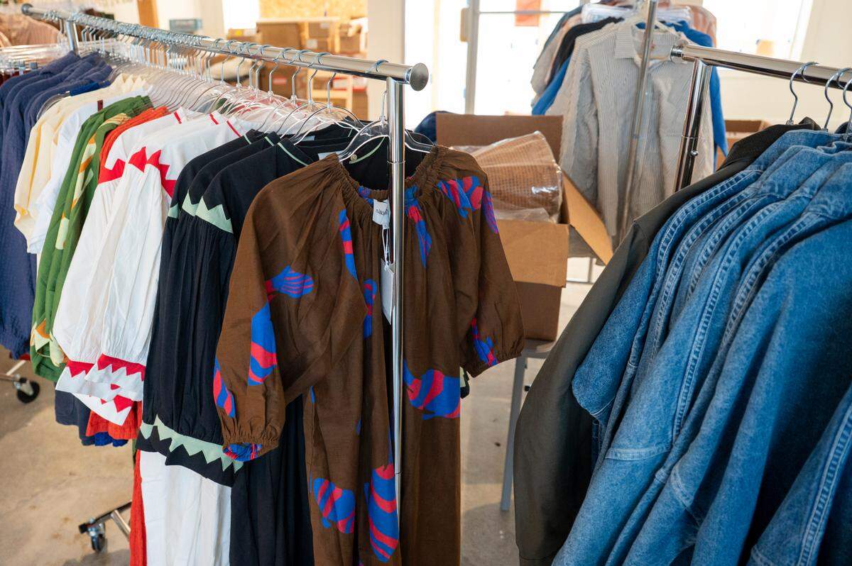 Racks are hung with clothes at the Good Luck Shop, a new clothing and goods store in the Proctor District, on Tuesday, June 17, 2025, as owner Ginny McClure prepares for a soft opening on Saturday, June 21, in Tacoma, Wash.