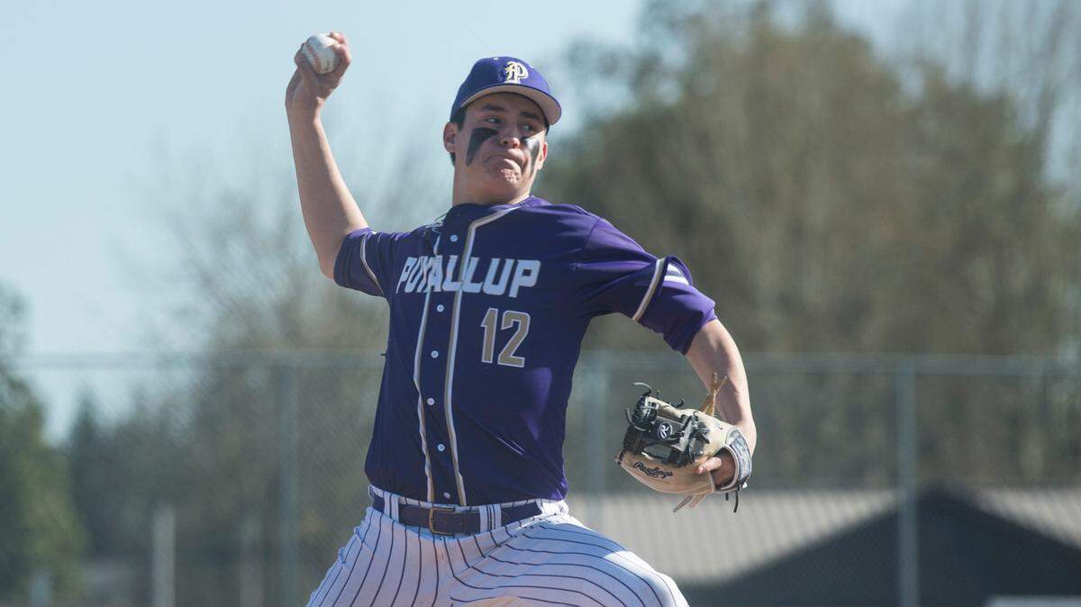 Puyallup starter Hunter Grasser throws a pitch in a Class 4A South Puget Sound League baseball game against Sumner on Tuesday, April 25, 2023 at Sumner High School in Sumner, Wash.