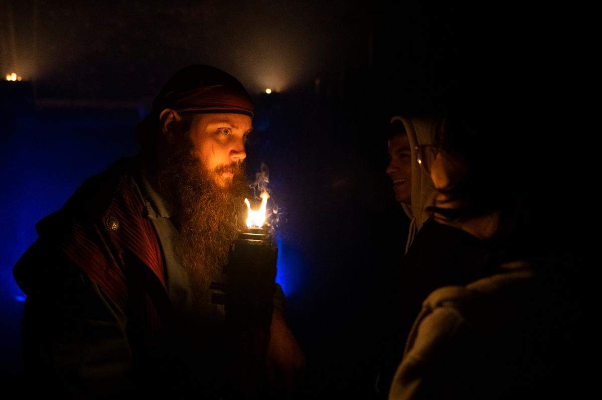 My Haunted Trail actor Robert Estes welcomes people to begin their journey along the mile long trail at My Haunted Forest at Grand Farms in Vaughn, Wash. on Oct. 23, 2022.