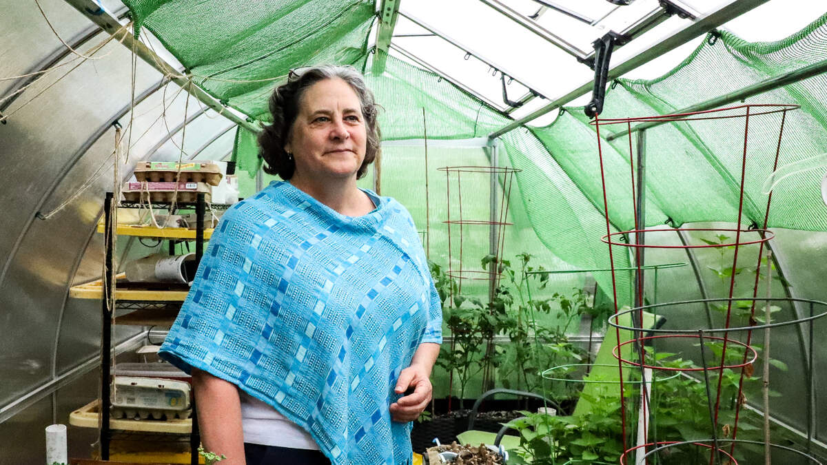 Maralise Hood Quan in her greenhouse in the backyard of her home in Tacoma on Friday, June 16. Quan was selected as the 2023 Greater Tacoma Peace Prize Laureate.