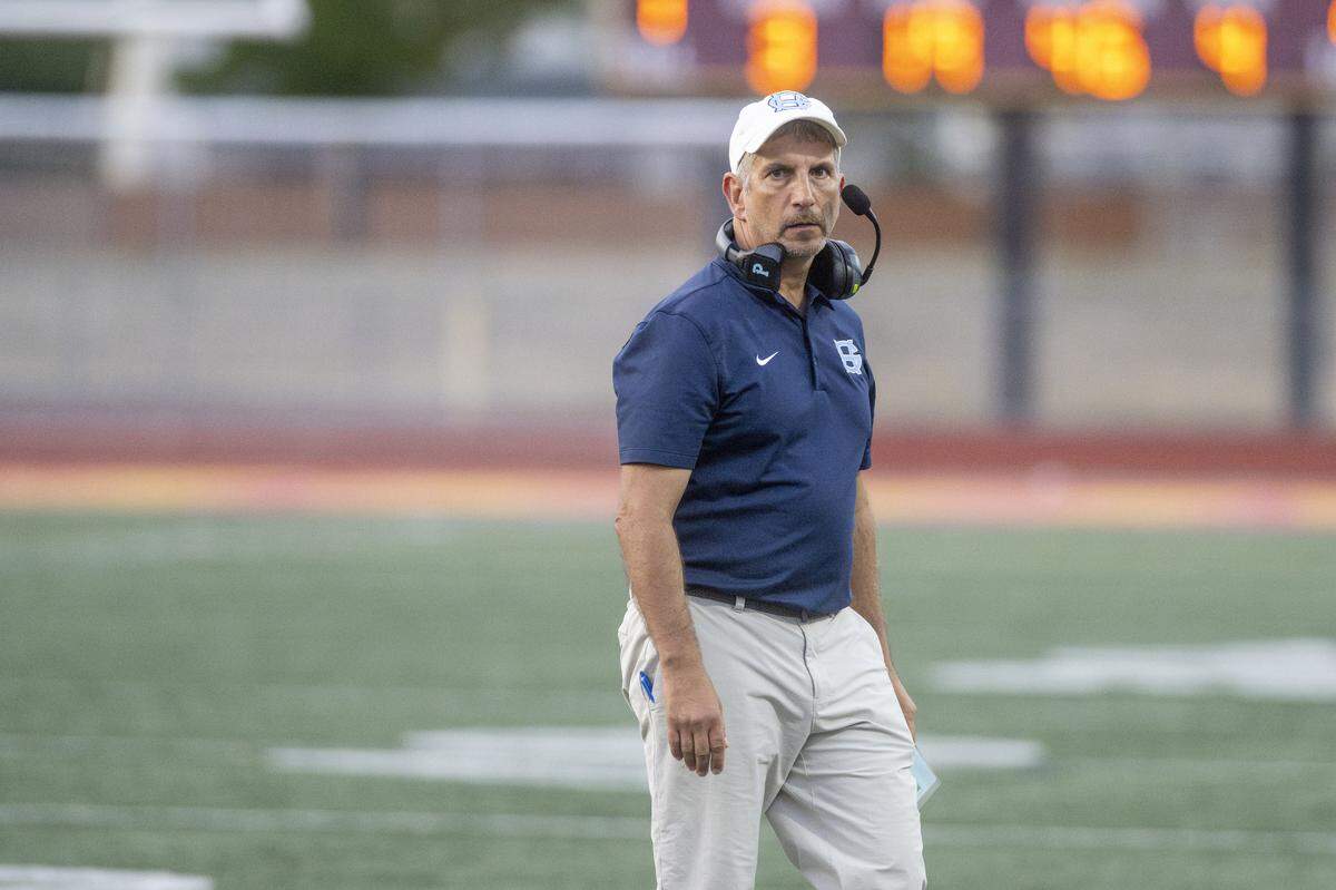 Gig Harbor head coach Jeff Scoma crosses the field during the Fish Bowl matchup against Peninsula on Saturday, Sept. 6, 2025, at Mount Tahoma Stadium in Tacoma, Wash.