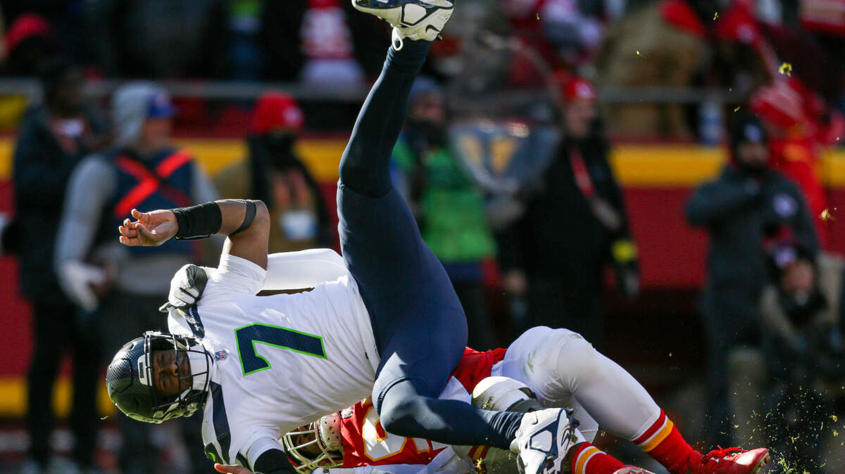Seattle Seahawks quarterback Geno Smith (7) is tackled by Kansas City Chiefs defensive tackle Chris Jones (95) during the second quarter on Saturday, Dec. 24, 2022, in Kansas City, MO.