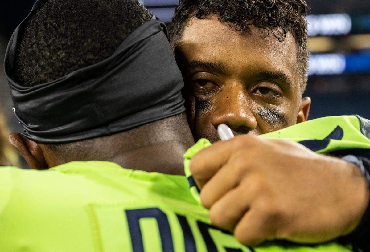 Denver Broncos quarterback Russell Wilson (3) hugs Seattle Seahawks safety Quandre Diggs (6) after the Seattle Seahawks beat the Broncos 17-16 in an NFL game on Monday, Sept. 12, 2022, at Lumen Field in Seattle.