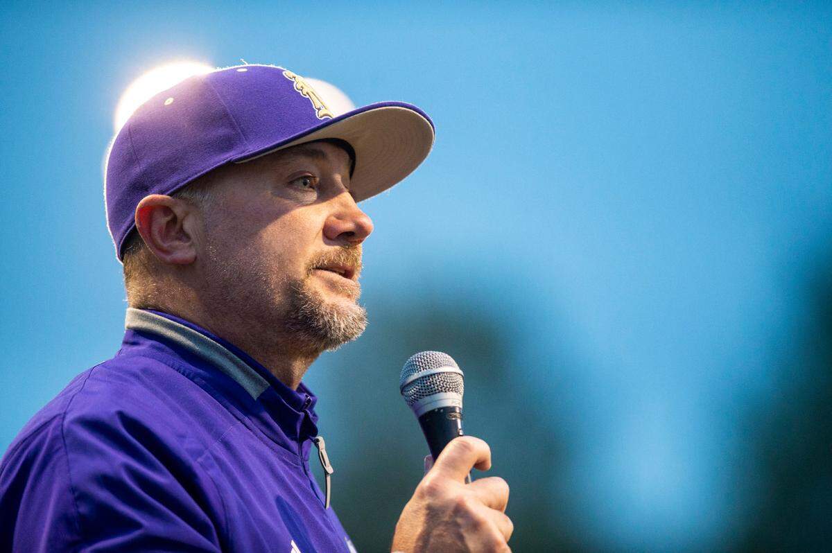 Puyallup head coach Marc Wiese addresses the fans who stuck around to celebrate his 500th win on Tuesday, May 3, 2022, at Heritage Park in Puyallup. Puyallup beat Graham-Kapowsin, 10-0.