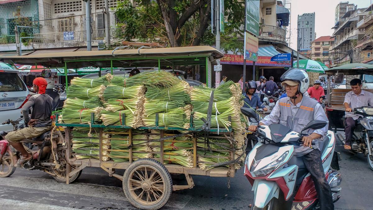 Motorists navigate a street in Phnom Penh, Cambodia on April 25, 2019.