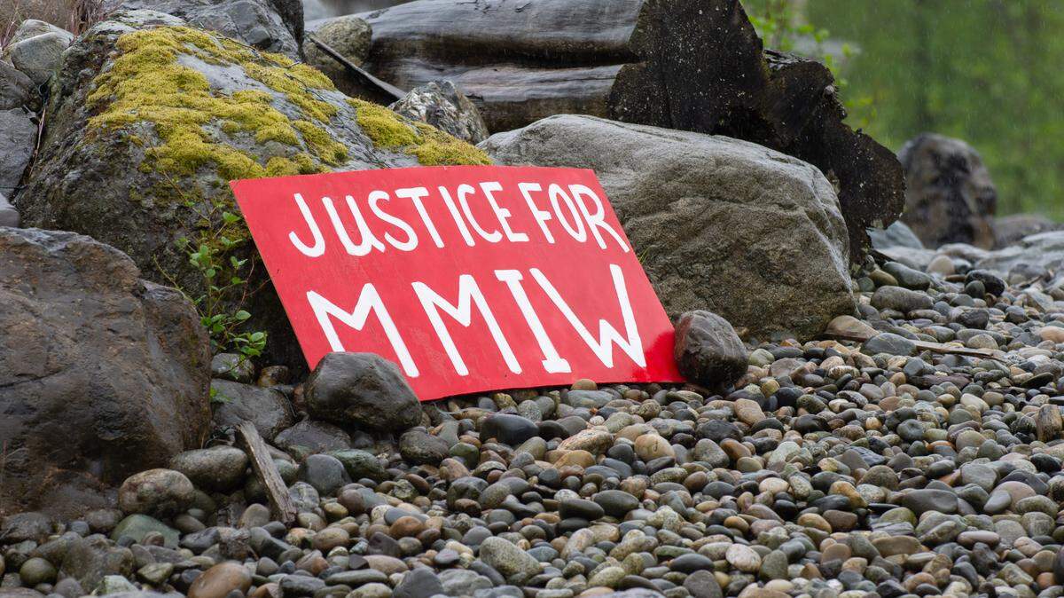 Around the Lummi Nation Reservation near Bellingham, Wash., signs and red dresses, shirts and children’s clothes were hung and placed in honor of missing and murdered Lummi Tribal members and Indigenous people for Missing and Murdered Indigenous Women and People Awareness Day Thursday, May 5, 2022. A sign at the Haxton Way and Kwina Road roundabout sits where about 50 Lummi Tribal and community members gathered to walk in observance of the day.