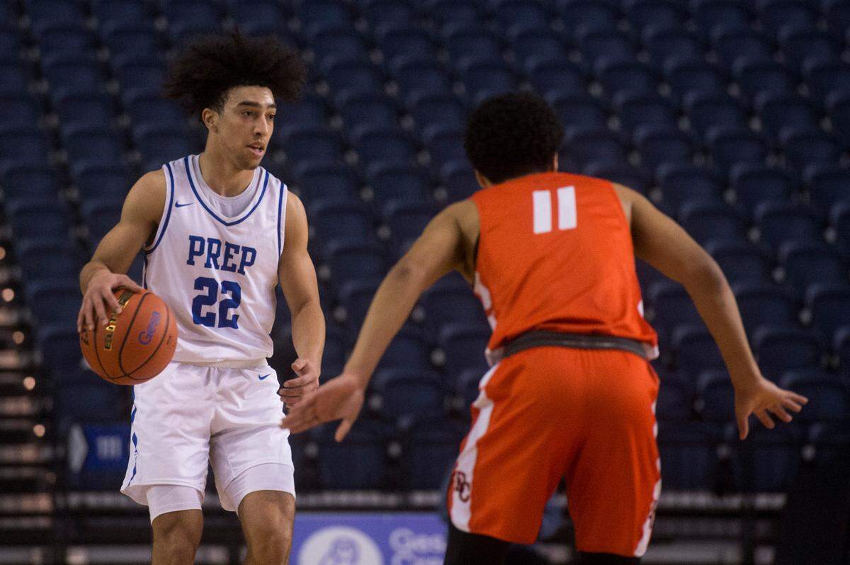 Seattle Prep guard Braeden Smith (22) brings the ball up the court in the second half. Seattle Prep beat Eastside Catholic, 55-50, in a Class 3A state basketball quarterfinals game on Thursday, March 3, 2022 at the Tacoma Dome in Tacoma, Wash.