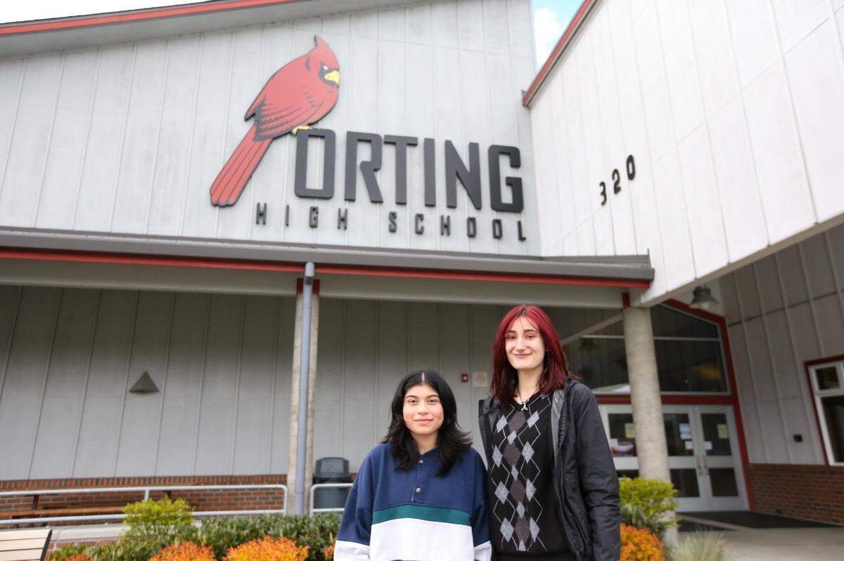 Culture Club President Julissa Valdovinos, left, and Dean Brandt, president of Students Helping Students, posing in front of Orting High School on Thursday, April 14. Valdovinos and Brandt are helping plan the second annual Culture Unity Night at the high school.