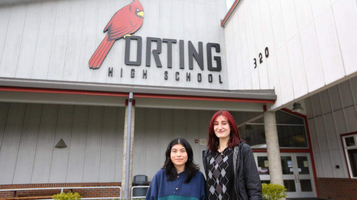 Culture Club President Julissa Valdovinos, left, and Dean Brandt, president of Students Helping Students, posing in front of Orting High School on Thursday, April 14. Valdovinos and Brandt are helping plan the second annual Culture Unity Night at the high school.