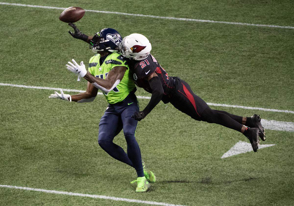 Arizona Cardinals cornerback Patrick Peterson defends a pass to Seattle Seahawks wide receiver DK Metcalf. The Seattle Seahawks played the Arizona Cardinals in a NFL football game at Lumen Field in Seattle, Wash., on Thursday, Nov. 19, 2020.